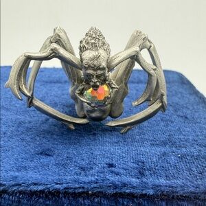 Pewter fantasy mythical faced spider figure w/ iridescent stone 2”